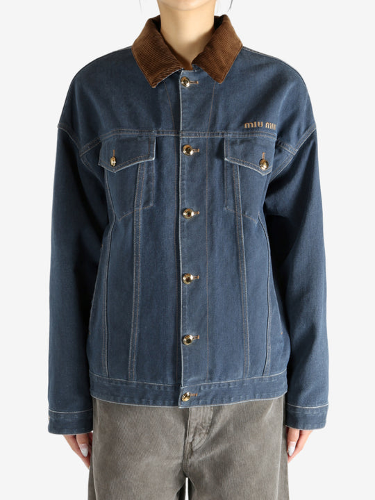 Blue jacket worn by a person, showing the jacket's fit