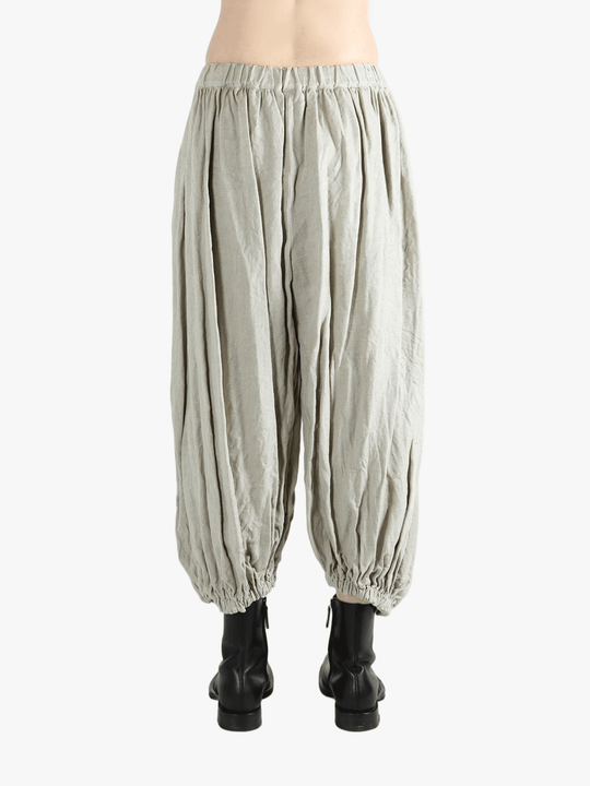 Grey pants worn by a person, showing the pants fit