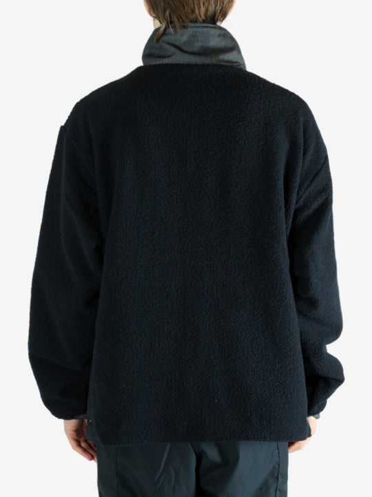 Navy jacket worn by a person, showing the jacket's fit