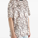 Tan t-shirts worn by a person, showing the t-shirts fit