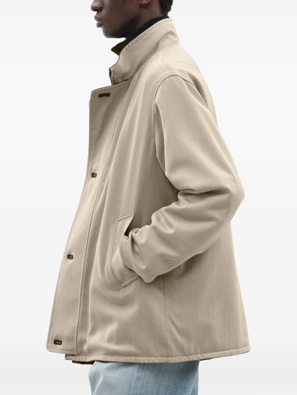 Tan jacket worn by a person, showing the jacket fit