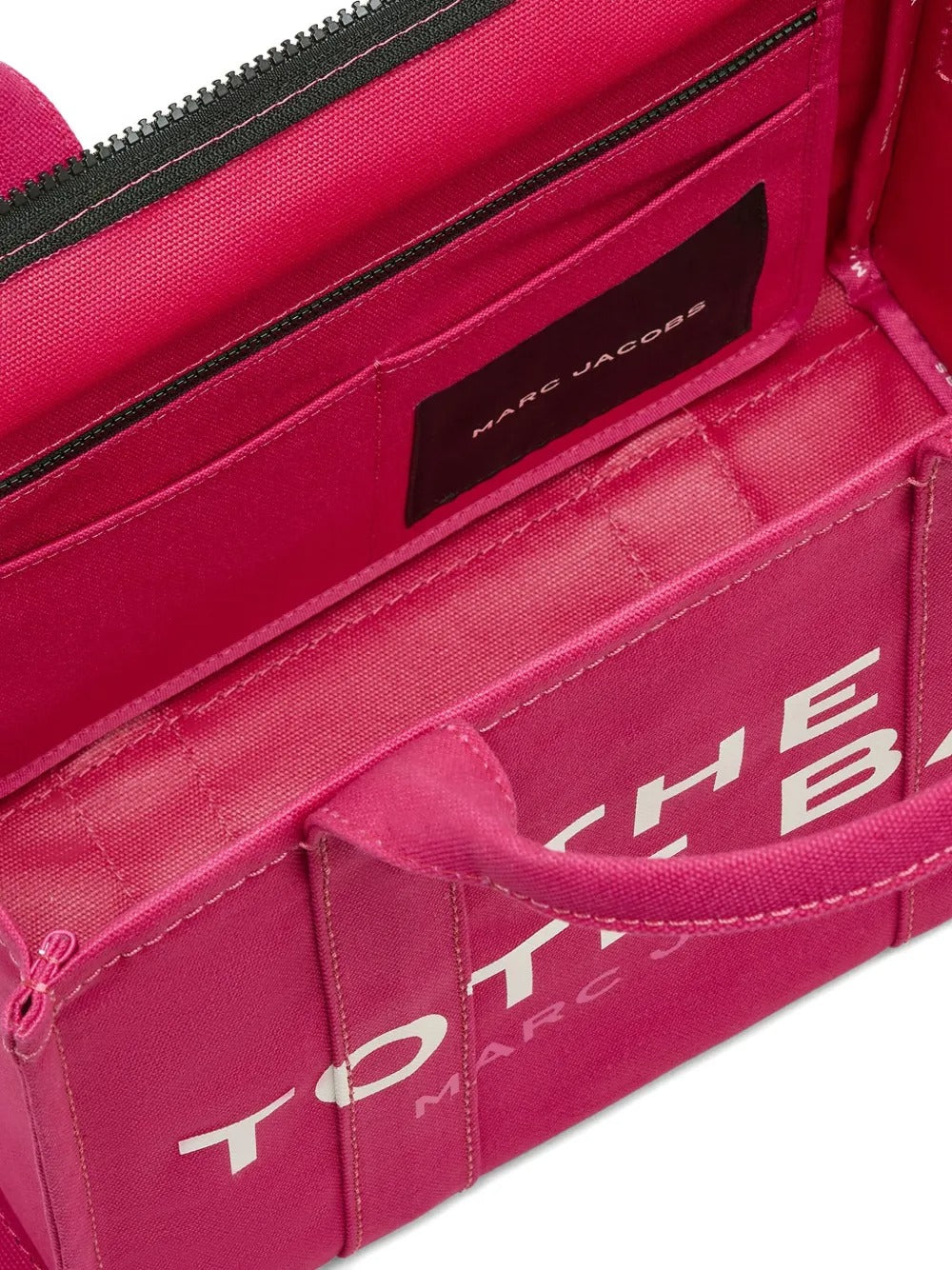Close up of pink bag, showing zip fastening