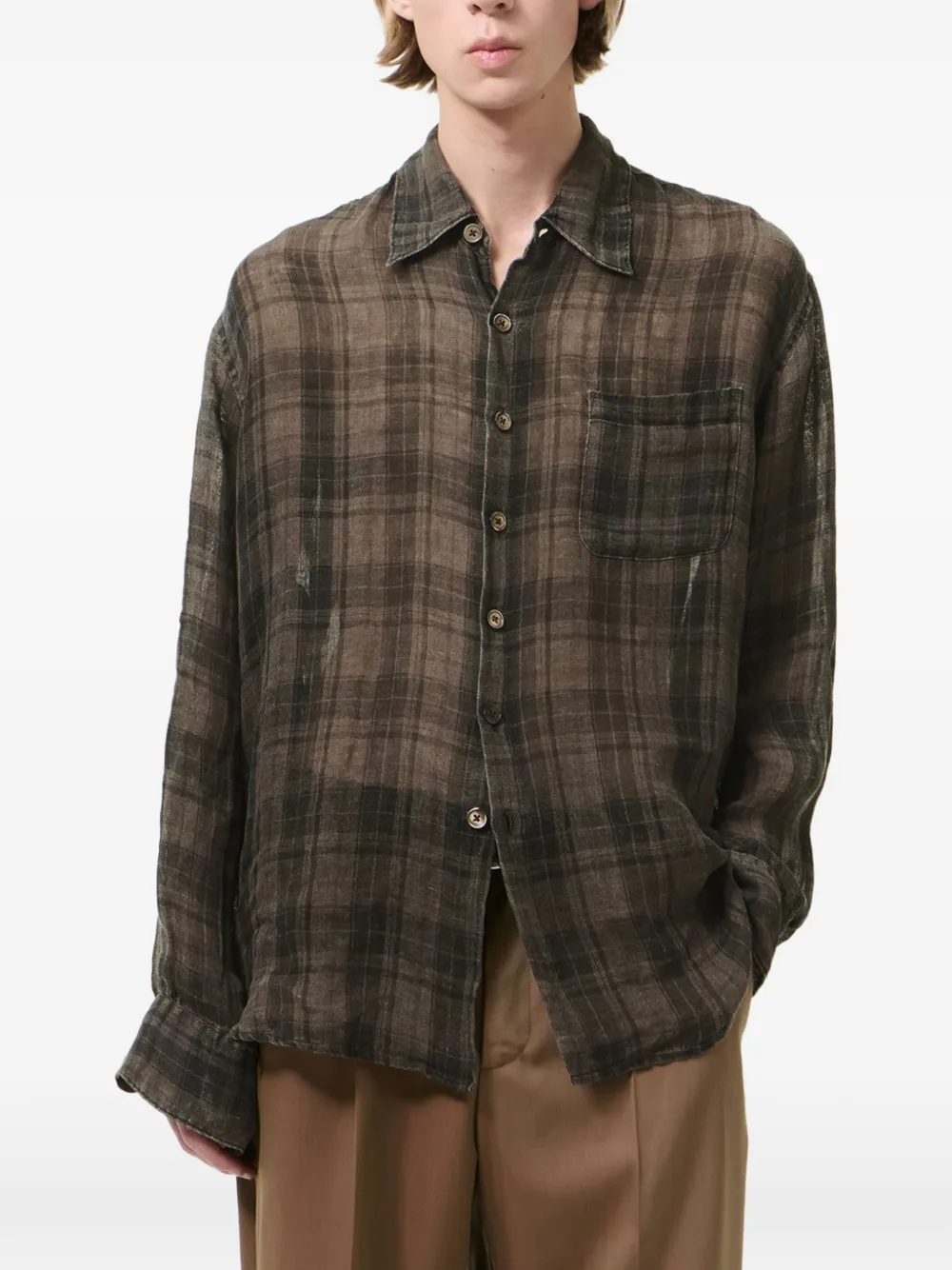 Grey shirt worn by a person, showing the shirt fit