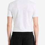 White shirt worn by a person, showing the shirt fit