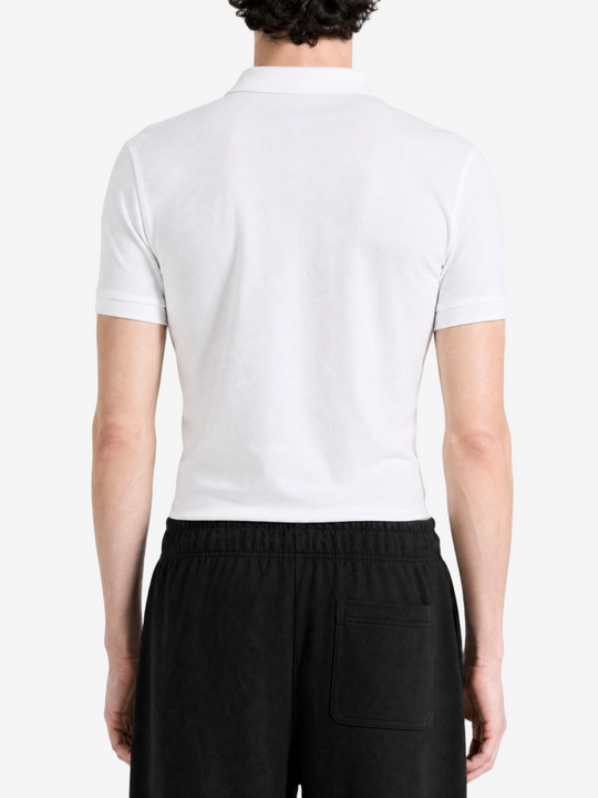 White shirt worn by a person, showing the shirt fit