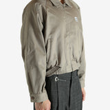 Tan jacket worn by a person, showing the jacket's fit