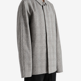 Grey jacket worn by a person, showing the jacket fit
