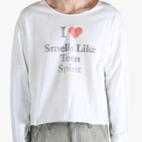 White top worn by a person, showing the top fit