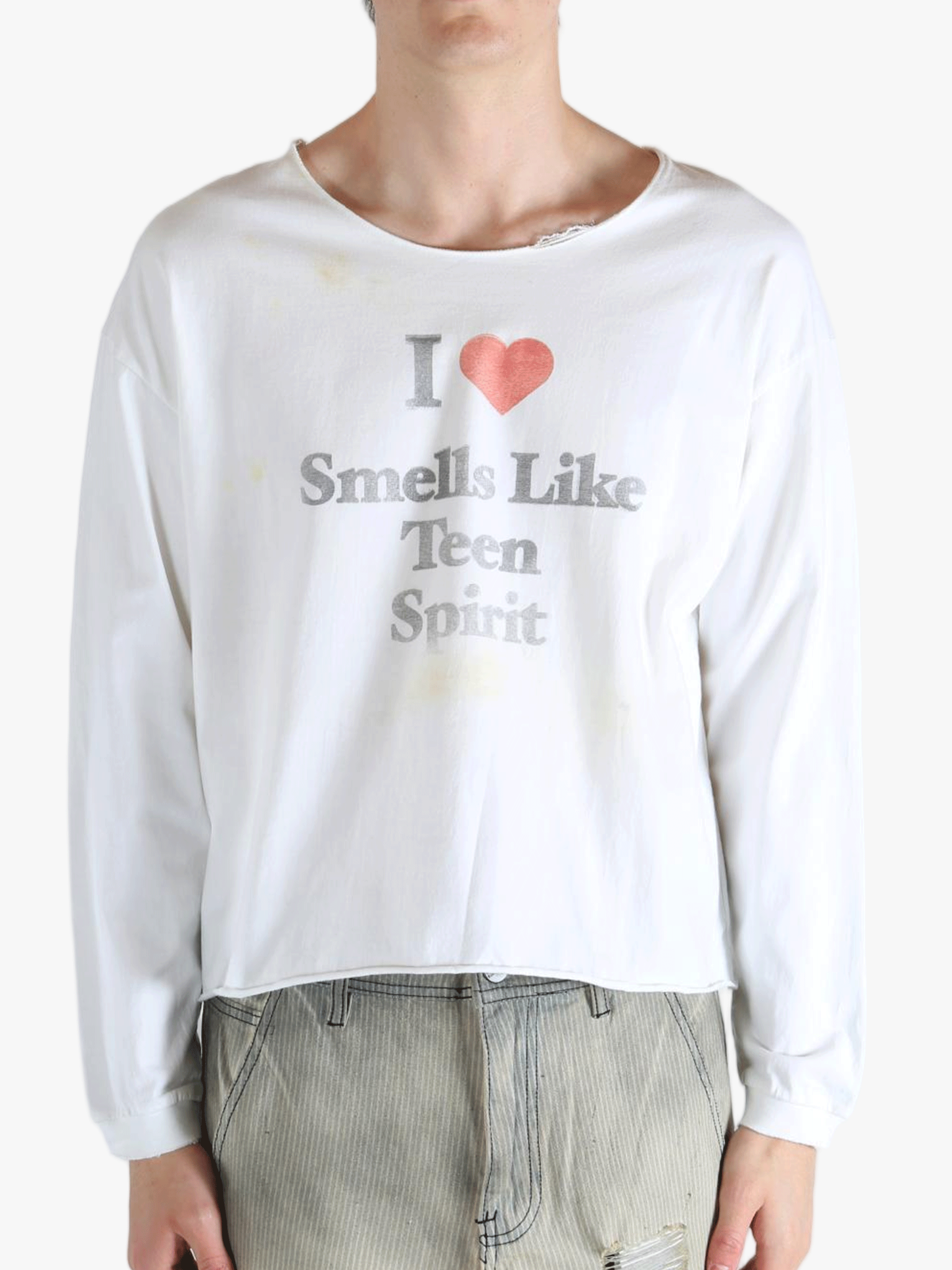 White top worn by a person, showing the top fit