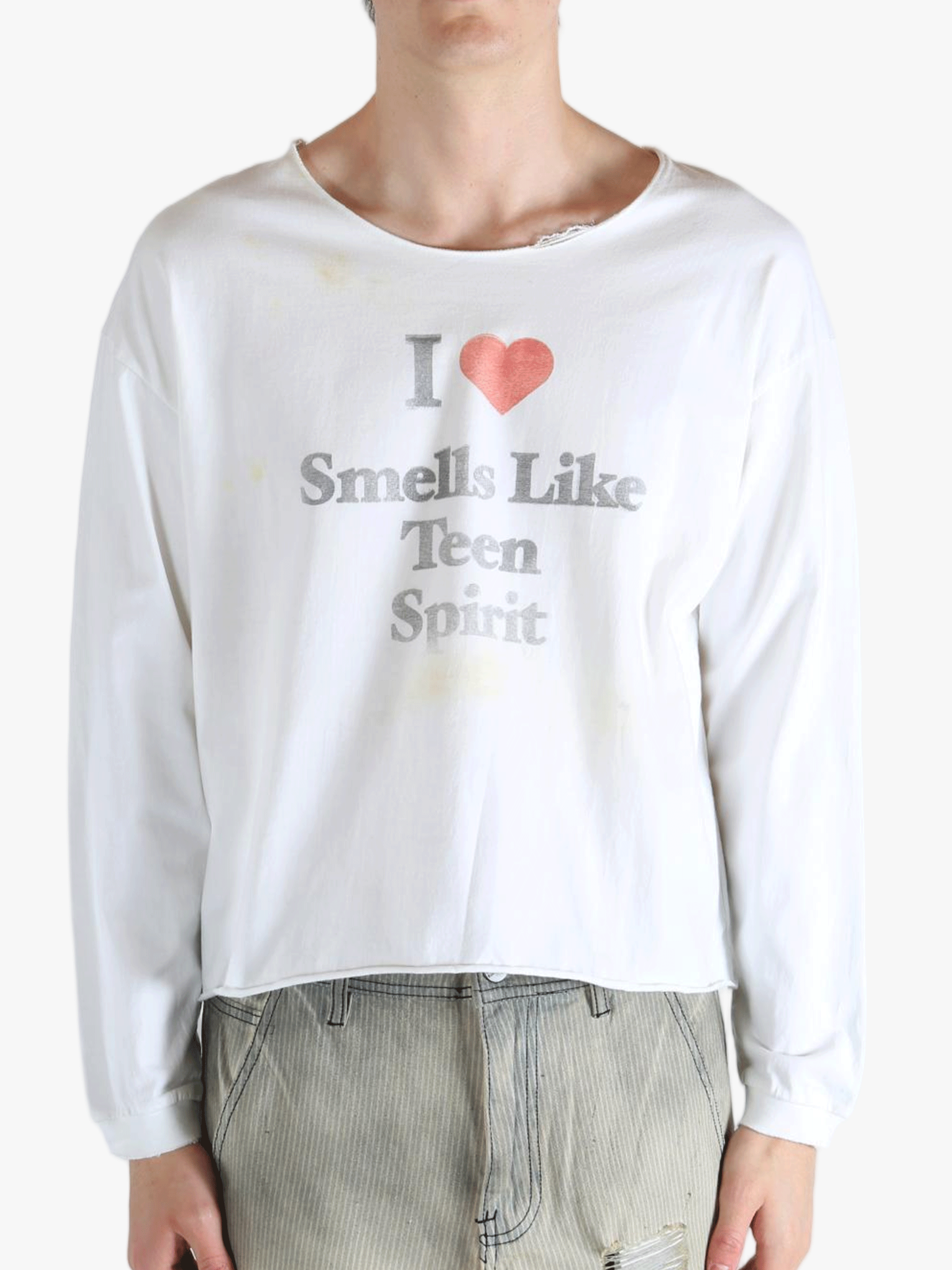 White top worn by a person, showing the top fit