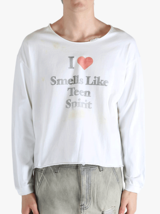 White top worn by a person, showing the top fit