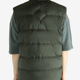 Green vest worn by a person, showing the vest's fit