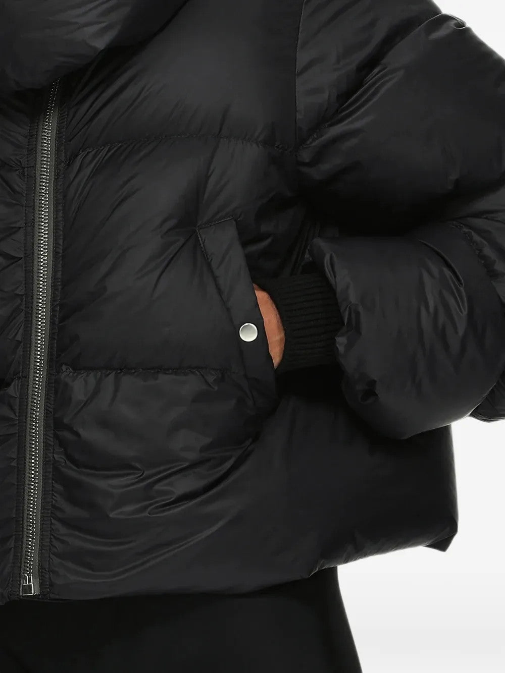 Black jacket worn by a person, showing the jacket fit