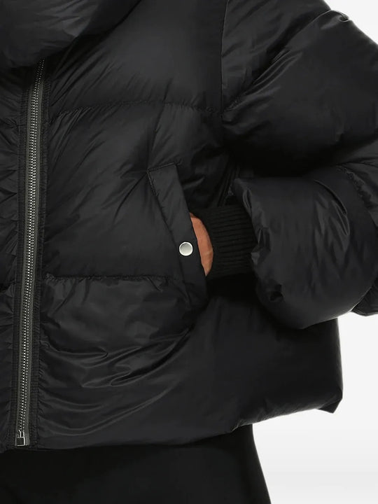 Black jacket worn by a person, showing the jacket fit