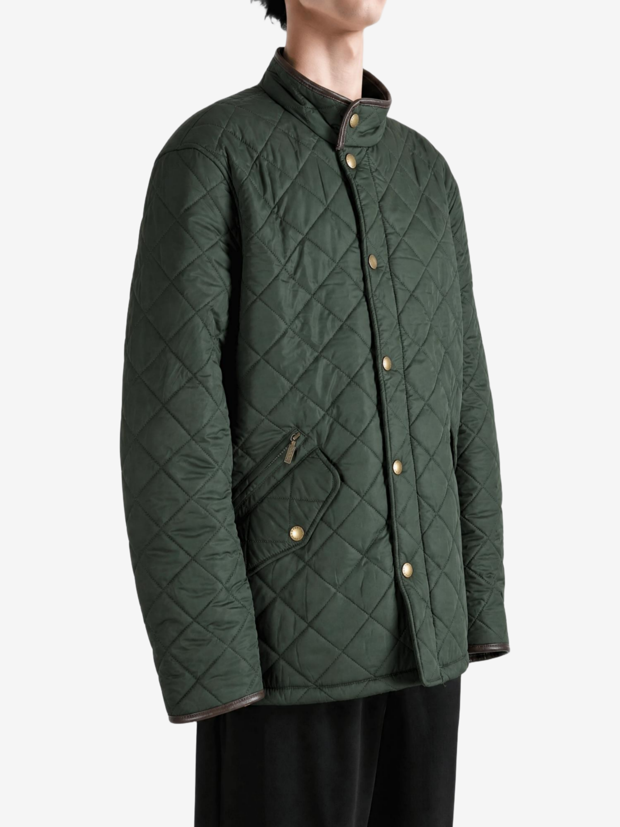 Green jacket worn by a person, showing the jacket fit