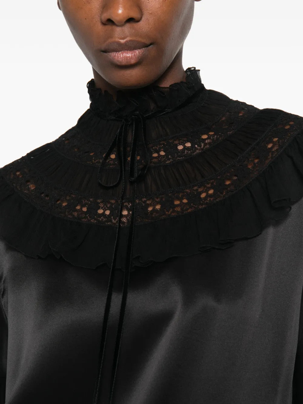 Black dress worn by a person, showing the dress fit