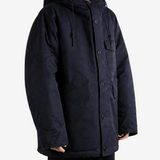 Navy jacket worn by a person, showing the jacket fit