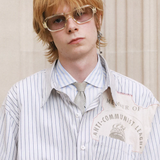 Blue shirt worn by a person, showing the shirt fit