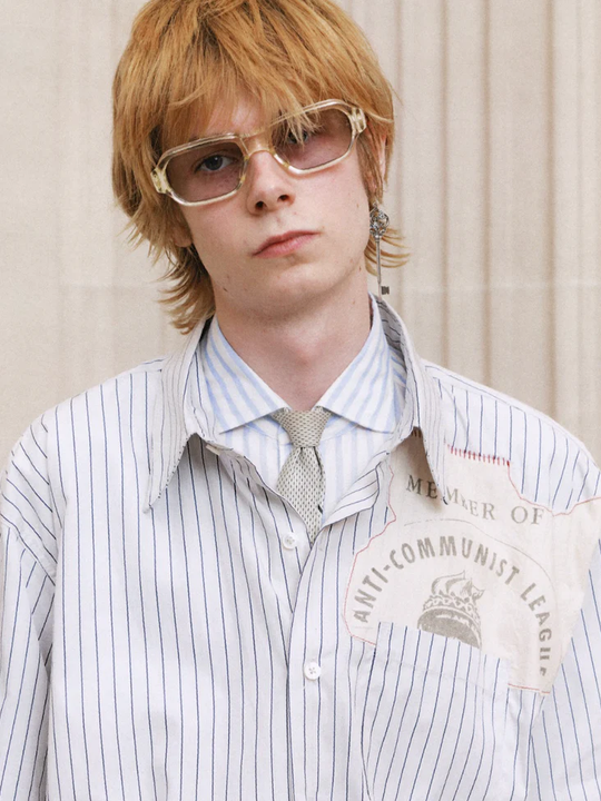 Blue shirt worn by a person, showing the shirt fit