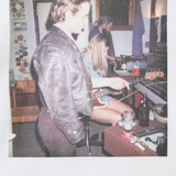 Close up of the white t-shirt, showing texture of the cotton fabric