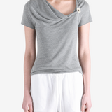 Grey top worn by a person, showing the top fit