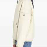 tan jacket worn by a person, showing the jacket fit