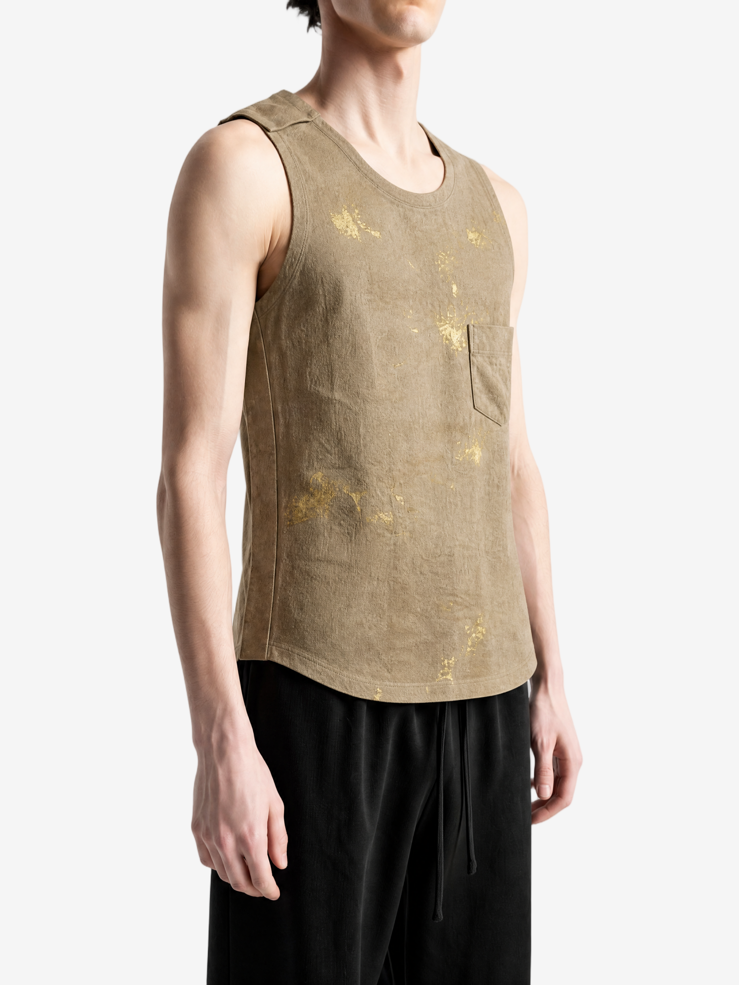 Tan top worn by a person, showing the top fit