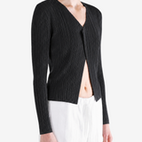 Black knitwear worn by a person, showing the knitwear fit
