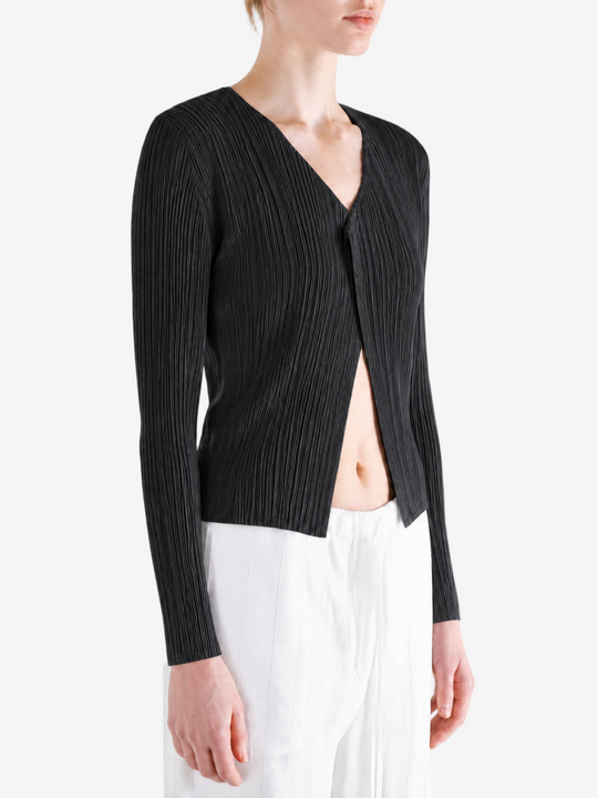 Black knitwear worn by a person, showing the knitwear fit