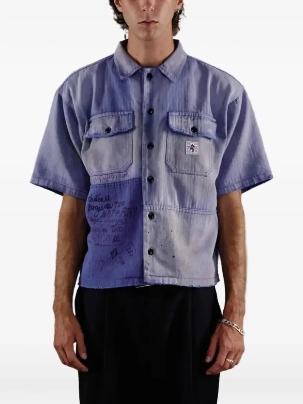 Blue shirt worn by a person, showing the shirt fit
