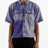Blue shirt worn by a person, showing the shirt fit