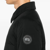 Black jacket worn by a person, showing the jacket fit
