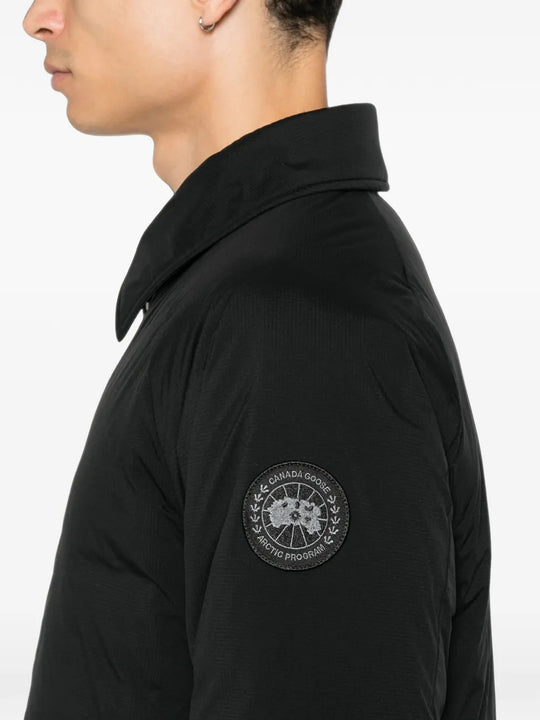 Black jacket worn by a person, showing the jacket fit