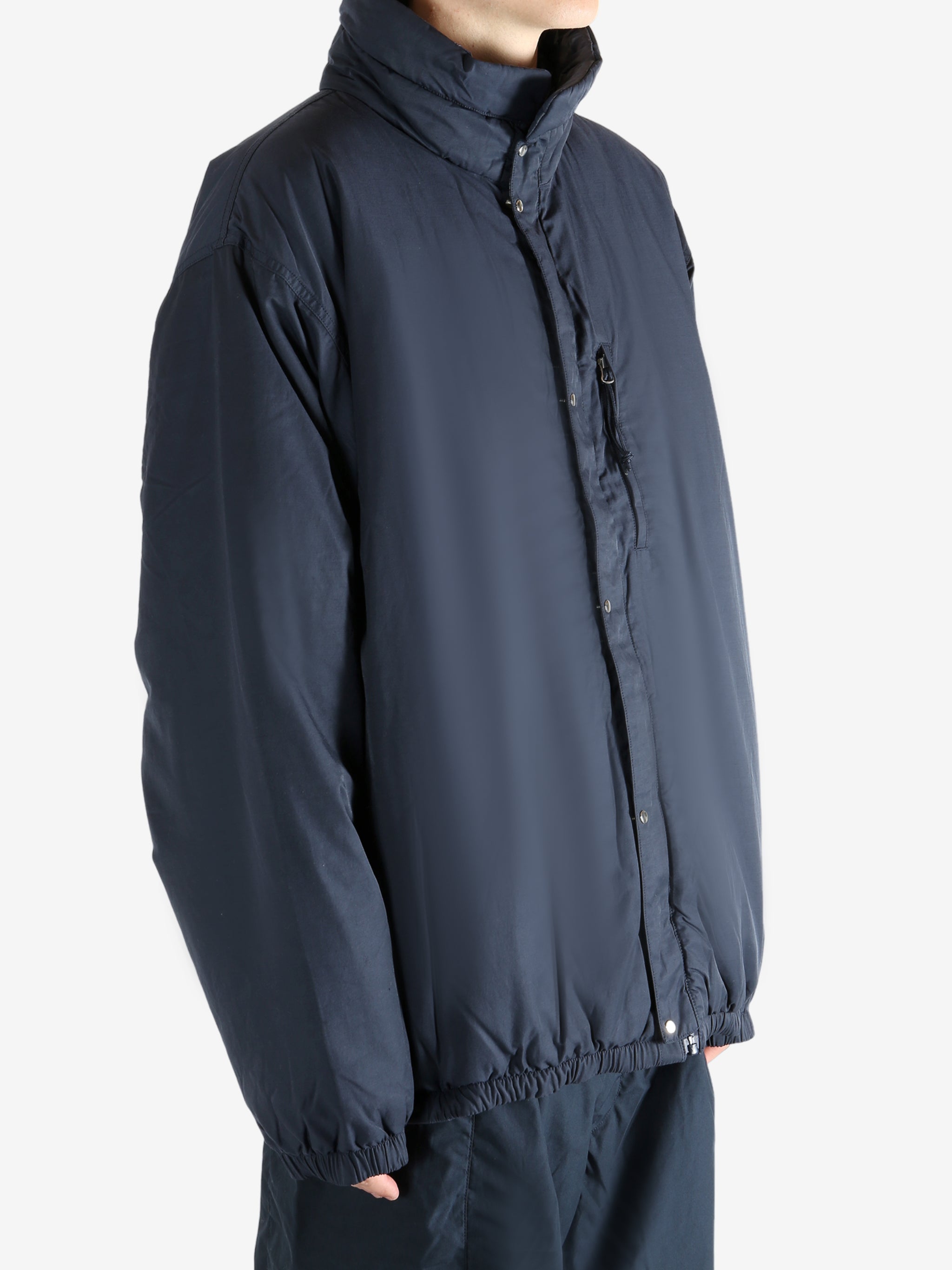 Navy jacket worn by a person, showing the jacket's fit