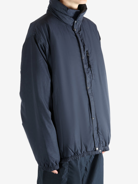 Navy jacket worn by a person, showing the jacket's fit