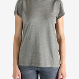 Grey t-shirt worn by a person, showing the shirt's fit