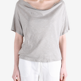 Grey knitwear worn by a person, showing the knitwear fit
