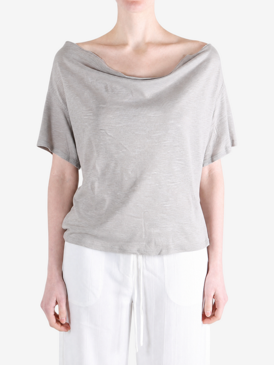 Grey knitwear worn by a person, showing the knitwear fit