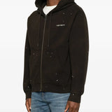 Black jacket worn by a person, showing the jacket fit