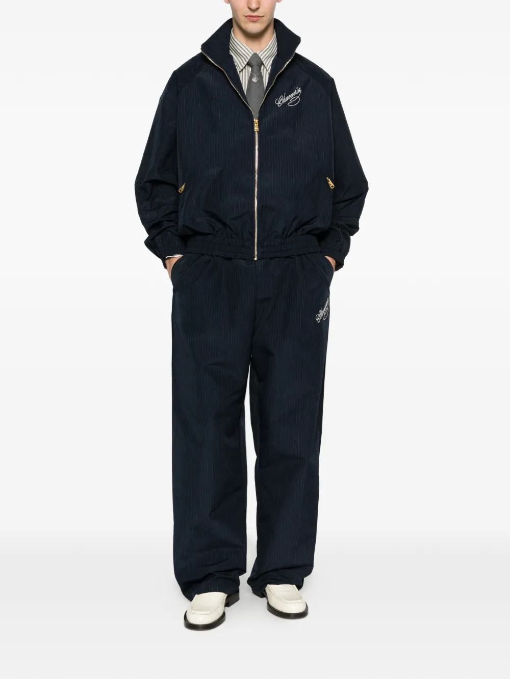 Navy pants worn by a person, showing the pants' fit