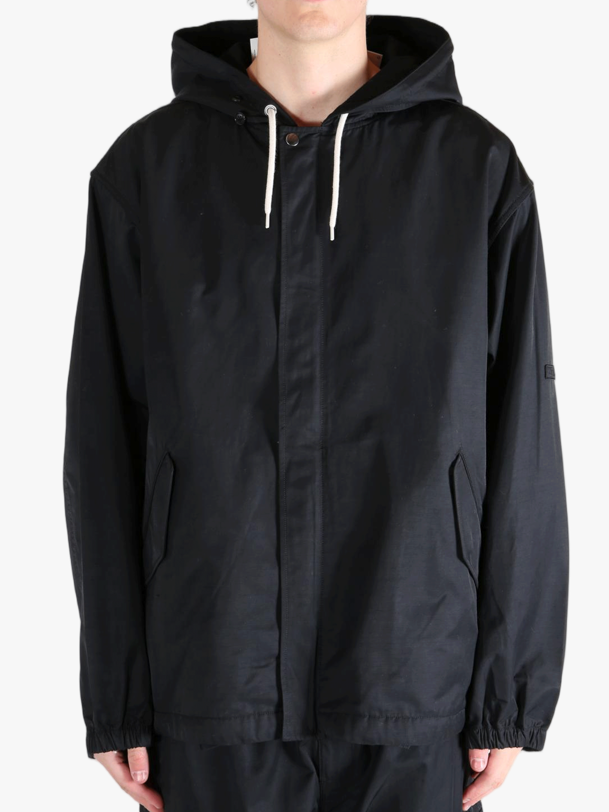 Black jackets worn by a person, showing the jackets fit