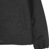 Close up of black jacket, showing texture of the wool fabric