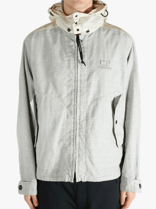 Light gray jacket worn by a person, showing the jacket fit