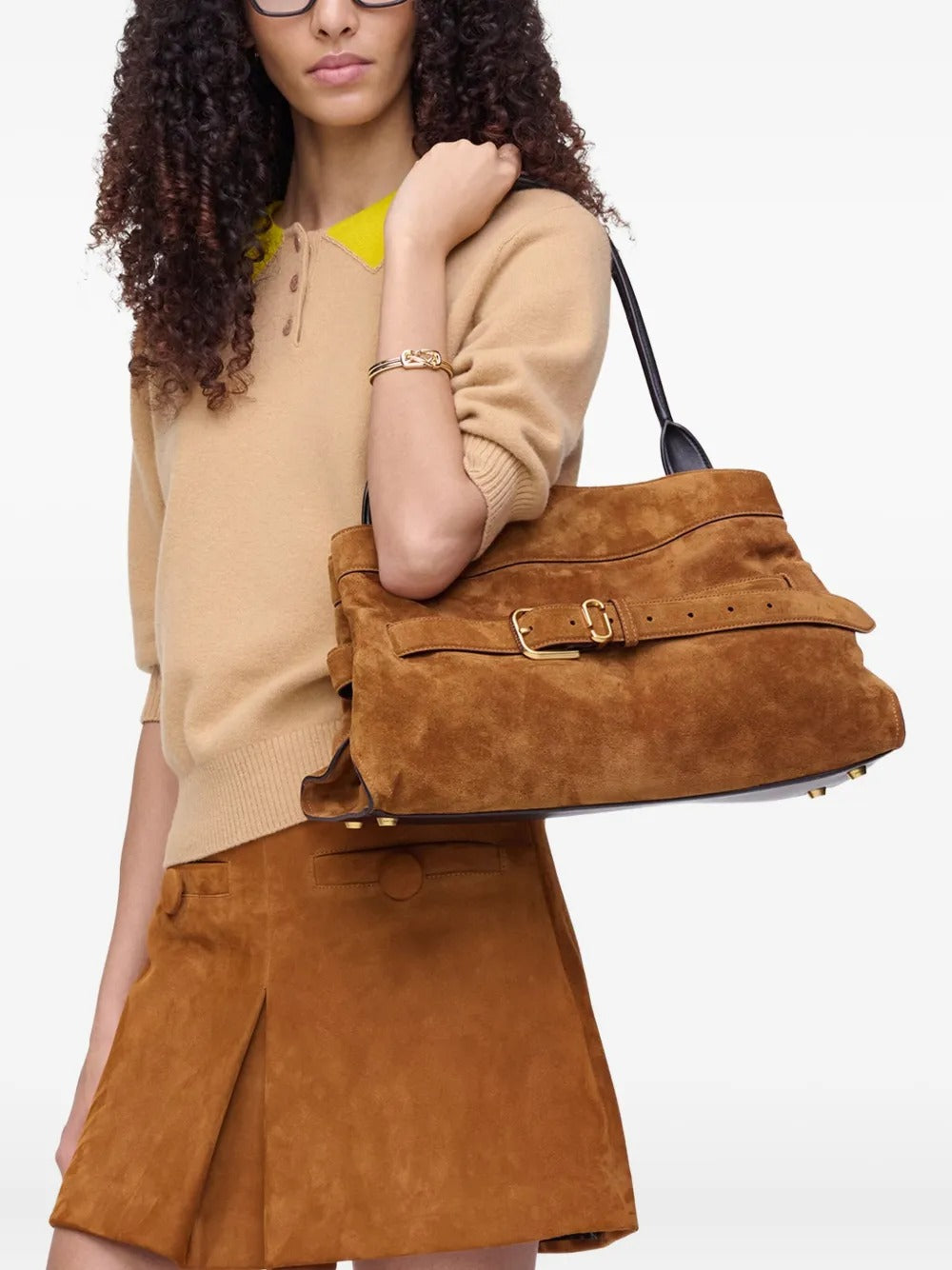 Brown bag worn by a person, showing the bag's fit