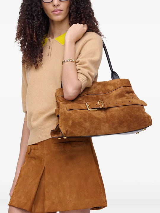Brown bag worn by a person, showing the bag's fit