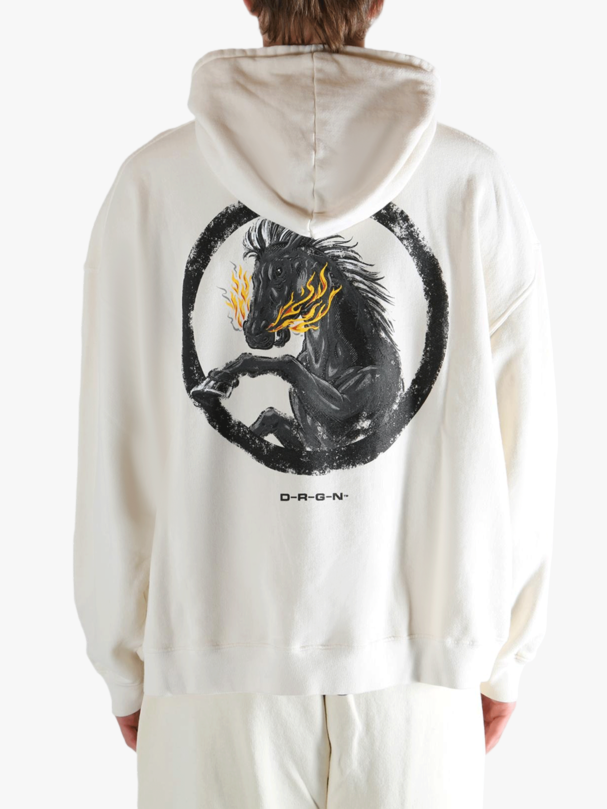 White hoodie worn by a person, showing the hoodie's fit