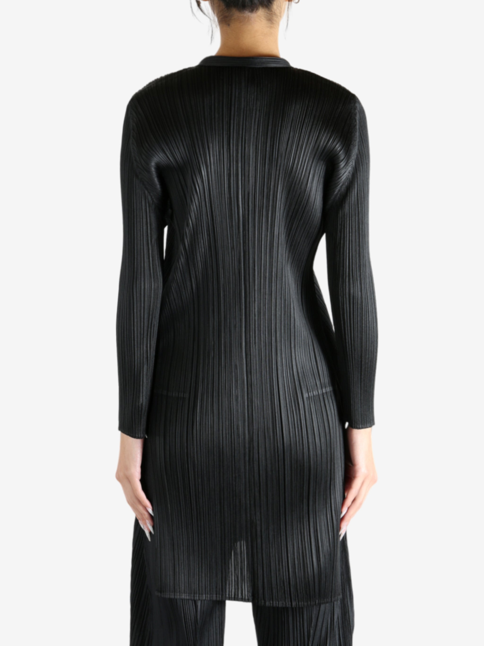 Black shirt worn by a person, showing the shirt's fit