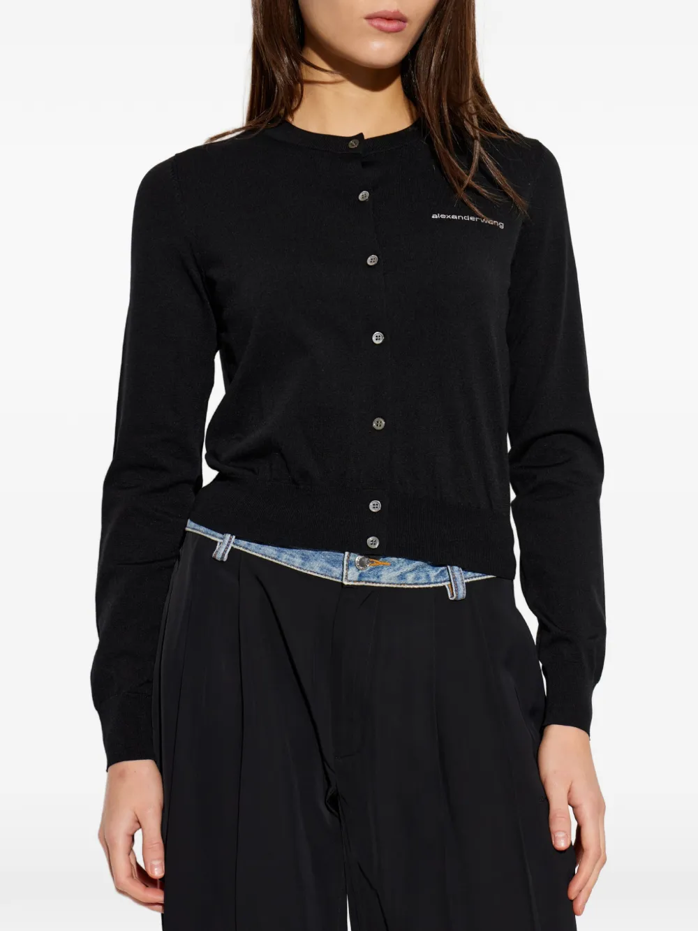 Black jacket worn by a person, showing the jacket fit
