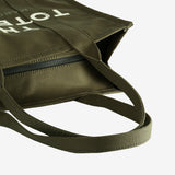 Close up of green bag, showing texture of the cotton fabric
