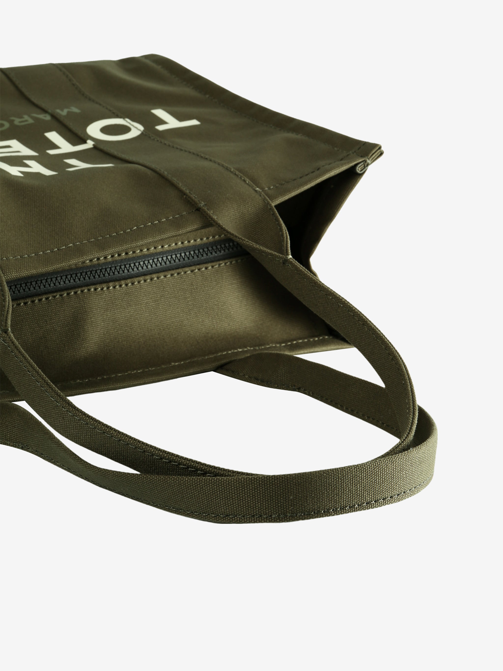 Close up of green bag, showing texture of the cotton fabric